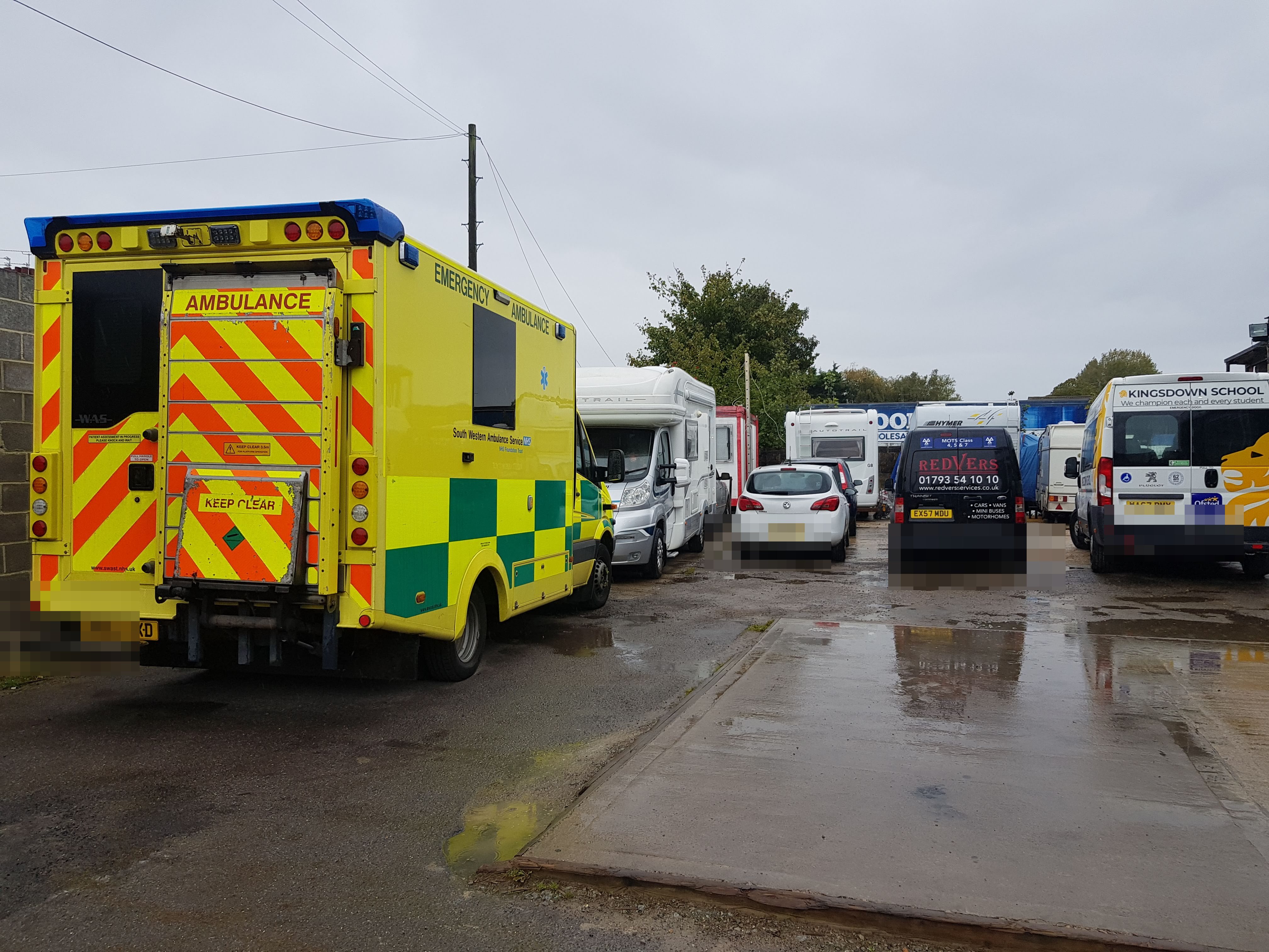 A full yard — ambulances, motorhomes & vans awaiting test